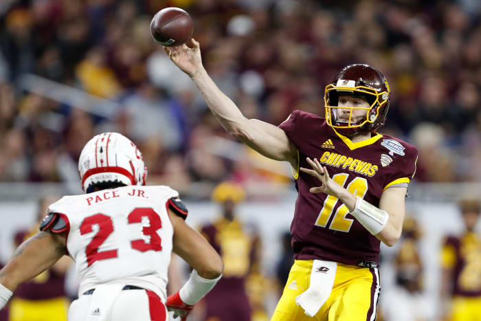 Dec 7, 2019; Detroit, MI, USA; Central Michigan Chippewas quarterback Quinten Dormady (12) passes the ball over Miami Redhawks linebacker Ivan Pace Jr. (23) during the fourth quarter in the MAC Championship game at Ford Field. Mandatory Credit: Raj Mehta-USA TODAY Sports